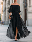 FJØRNA off-shoulder pleated chiffon maxi dress with flowing fabric and elegant design, showcased on a model.