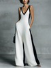 FJØRNA black and white cotton-linen women's jumpsuit with deep V-neck, wide-leg pants, spaghetti straps, and a stylish casual look.