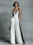 Black and white cotton-linen jumpsuit for women with deep V-neck, wide-leg pants, spaghetti straps by FJØRNA.