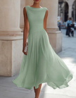 FJØRNA chiffon midi dress for women with draped neckline and pleated design, showcasing a flowing, elegant fabric.