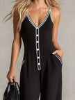 Black colour-block V-neck sleeveless jumpsuit by FJØRNA featuring button-down front and relaxed fit.