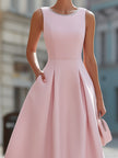 Elegant sleeveless fit and flare midi cocktail dress by FJØRNA with rhinestone neckline, perfect for formal occasions.