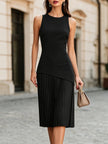 FJØRNA elegant sleeveless asymmetrical pleated midi dress with round neckline, flowing fabric and stylish design.