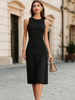 FJØRNA elegant sleeveless asymmetrical pleated midi dress with round neckline, stylish and flowy for special occasions.