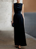 FJØRNA elegant sleeveless maxi dress with draped design and waist definition, showcasing a flowing, sophisticated style.