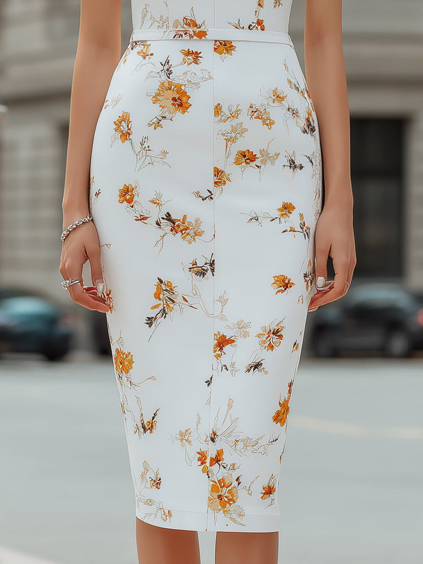 FJØRNA floral print deep V-neck sleeveless bodycon midi dress displayed on a mannequin, showcasing vibrant pattern and fitted style.