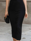 FJØRNA ruffled deep V-neck sleeveless bodycon midi dress displayed on model with floral background.