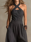 Charcoal pinstripe halter neck wide-leg jumpsuit for women by FJØRNA, featuring a stylish halter neckline and flowing wide-leg design.