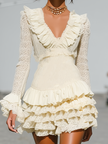 Cream lace ruffle long sleeve tiered mini dress from FJØRNA featuring delicate lace details and a flowy, feminine silhouette.