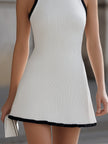 FJØRNA ribbed knit high neck sleeveless A-line mini dress with contrast trim and flared skirt, stylish and fitted design.