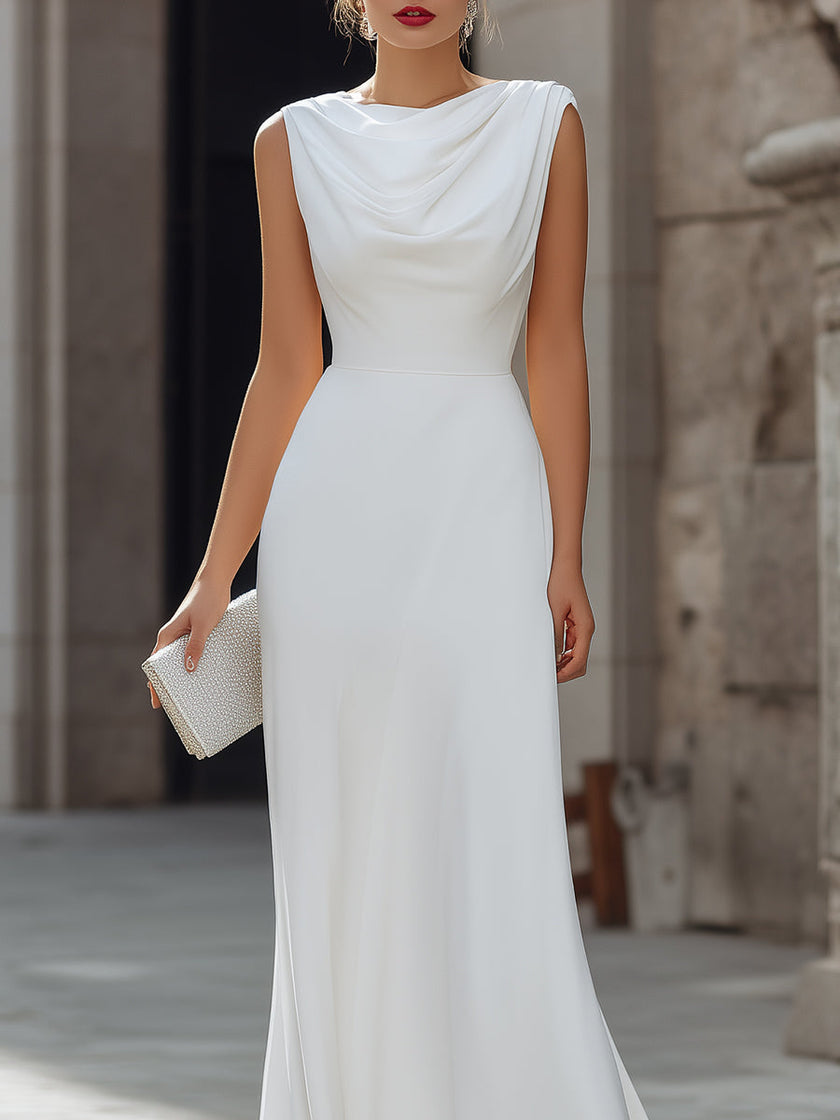 FJØRNA sleeveless draped cowl neck A-line maxi dress with flowing fabric and elegant silhouette, displayed on a hanger.