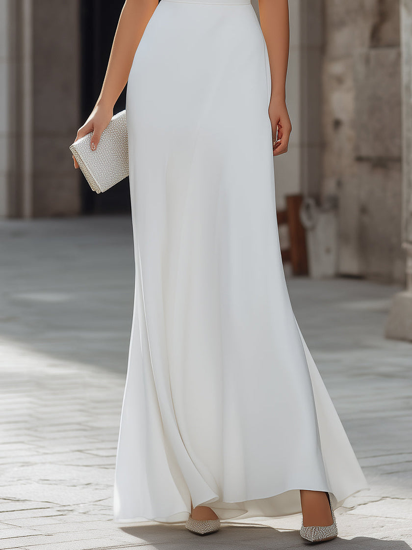 FJØRNA sleeveless draped cowl neck A-line maxi dress with flowing fabric and elegant silhouette, displayed on a hanger.