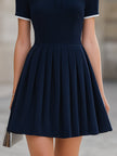 Navy blue contrast collar polo neck pleated flared A-line mini dress by FJØRNA, featuring a stylish collar and pleated skirt.