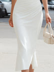 FJØRNA cold-shoulder draped high-neck elegant midi dress with flowing fabric and sophisticated design, suitable for formal occasions.