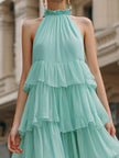 FJØRNA halter neck tiered ruffle flowing midi dress with layered ruffles and a flowing silhouette, perfect for summer wear.