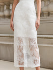 FJØRNA spaghetti strap lace overlay bodycon midi dress displayed on a hanger with intricate lace details and a fitted silhouette.