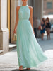FJØRNA halter neck pleated flowing maxi dress with a relaxed fit and elegant design, perfect for summer or special occasions.