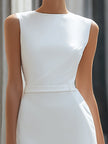 FJØRNA sleeveless asymmetrical panel tailored maxi dress with a flowing design and sleek silhouette, perfect for elegant occasions.