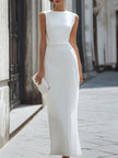 FJØRNA sleeveless asymmetric panel tailored maxi dress with a sleek, modern silhouette and elegant design in a neutral fabric.