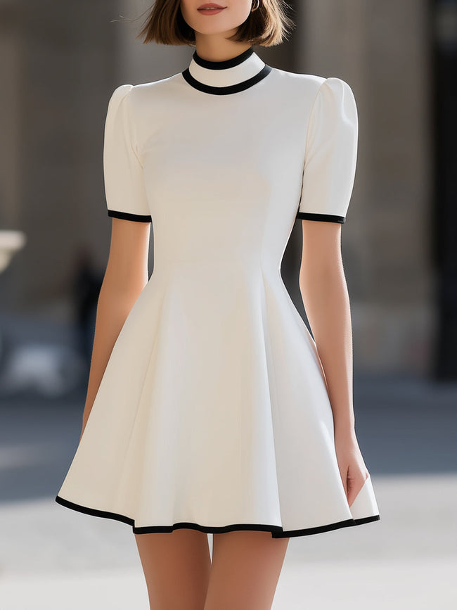 FJØRNA white high neck short sleeve flared A-line mini dress with contrast trim, stylish and elegant for casual or formal wear.