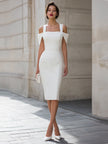 White FJØRNA cold shoulder square neck bodycon midi dress, featuring long sleeves and fitted silhouette, displayed on a hanger.
