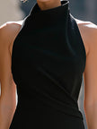 FJØRNA high-neck halter draped bodycon midi dress shown on a model, featuring a fitted silhouette and elegant design.