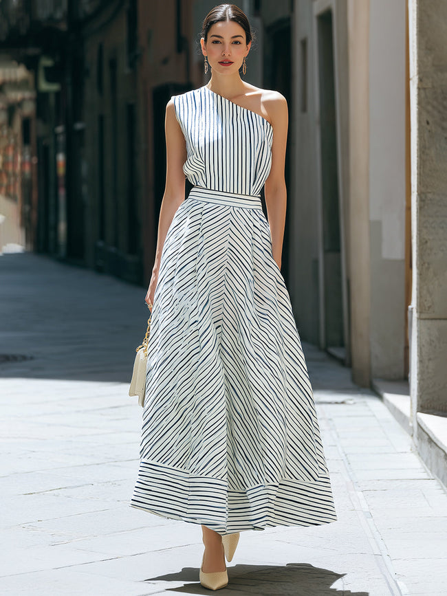 FJØRNA one-shoulder striped pleated midi dress featuring a stylish silhouette and elegant design, perfect for a sophisticated look.