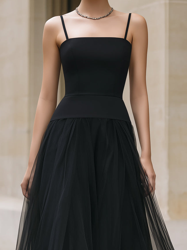 Elegant black tiered tulle maxi dress by FJØRNA featuring flowing layers and a sophisticated silhouette.