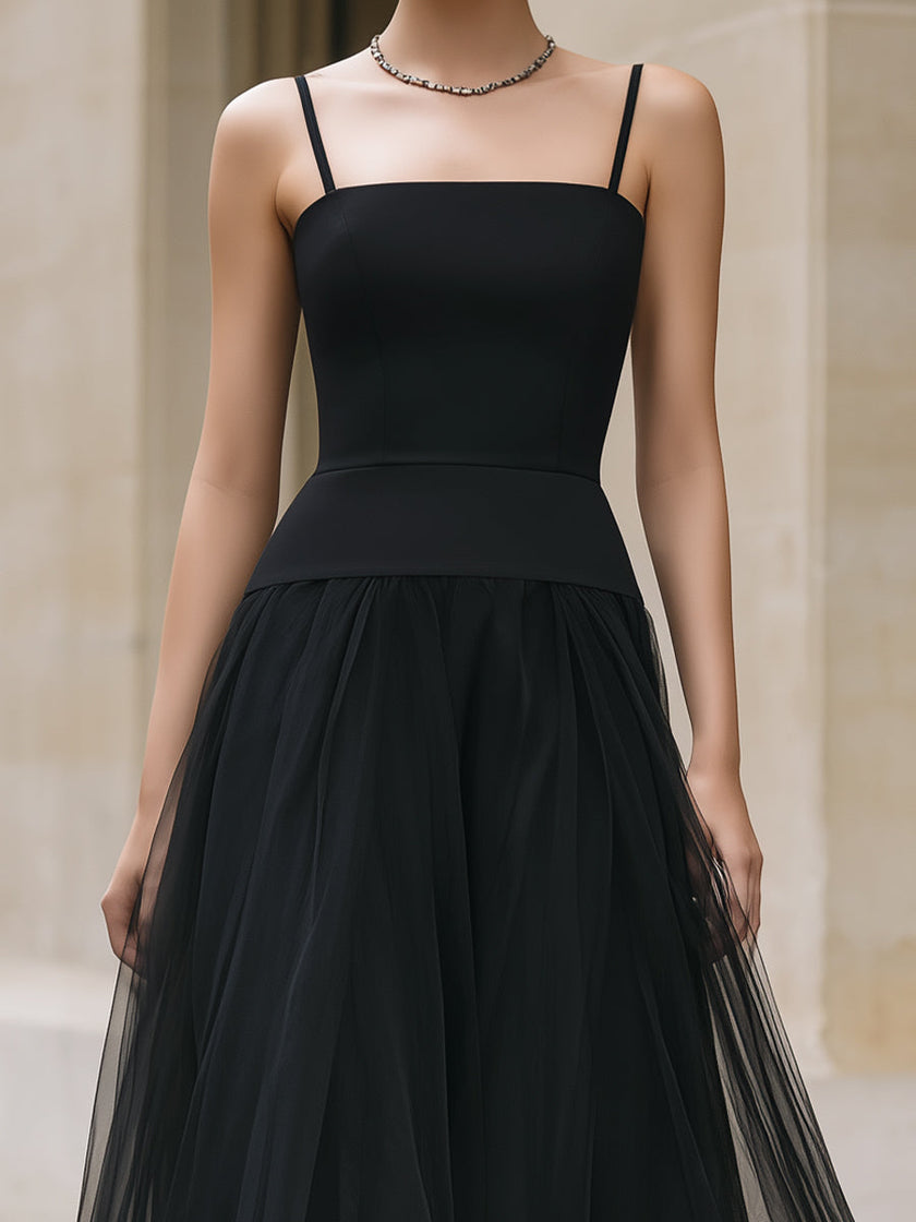 Elegant black tiered tulle maxi dress by FJØRNA featuring flowing layers and a sophisticated silhouette.