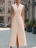 Elegant beige sleeveless midi dress with lapel collar by FJØRNA, seen from front with fitted waist and flowing skirt.