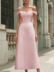FJØRNA elegant pink off-the-shoulder sleeveless maxi dress displayed on a hanger with flowing fabric and a fitted waist.