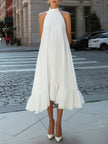 FJØRNA sleeveless pleated halter neck flowing asymmetric midi dress displayed on a model.
