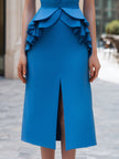 FJØRNA sleeveless tailored midi dress with lapel collar, structured fit, and sleek design, perfect for elegant occasions.