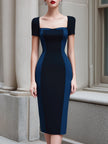 FJØRNA colorblock panel sleeveless midi dress with short sleeves, structured design and vibrant color accents.