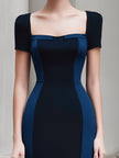 FJØRNA colorblock panel sleeveless structured midi dress with short sleeves, featuring a stylish colorblock design and fitted silhouette.