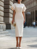 FJØRNA minimalist halter neck column midi dress displayed on a model, showcasing its sleek design and elegant fit.