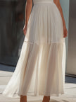 FJØRNA spaghetti strap pleated flowing maxi dress with a relaxed fit and elegant design, perfect for summer occasions.