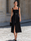 FJØRNA black square neck sleeveless belted zip-up midi dress with front slit, showcasing a fitted silhouette and elegant design.