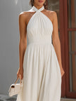 White twist halter neck maxi dress with smocked waist and flowy skirt by FJØRNA, perfect for summer or special occasions.