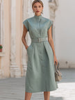 FJØRNA elegant stand collar belted button-down midi shirt dress hanging on a hanger with a neutral background.