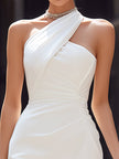 FJØRNA asymmetric draped halter neck sculpted midi dress shown on a model, featuring elegant draping and a fitted silhouette.