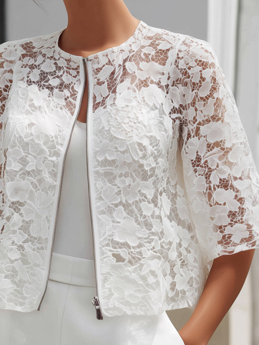 White lace cropped jacket for women with floral overlay and zip front, stylish FJØRNA top ideal for casual or dressy outfits.