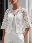 White lace cropped jacket for women by FJØRNA featuring floral overlay and zip front, stylish top for feminine fashion.