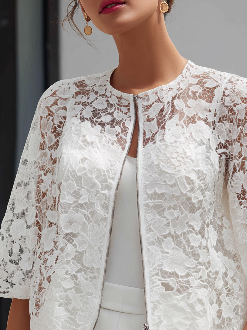White lace cropped jacket for women with floral overlay and zip front, by FJØRNA, stylish and lightweight top.