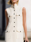 FJØRNA sleeveless utility pocket shift mini dress with stand collar and button-down front, shown from front view.