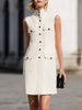 FJØRNA sleeveless utility pocket shift mini dress with stand collar and button-down front, shown hanging on a plain background.