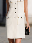 FJØRNA sleeveless utility pocket shift mini dress with stand collar and button-down front, shown on model.