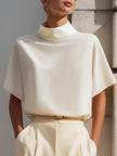 White FJØRNA women's high neck sleeveless blouse with draped minimalist design, showcasing a clean, elegant top for women.