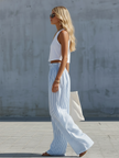 White cotton scoop neck tank top for women by FJØRNA, casual sleeveless top with fitted design and soft fabric.