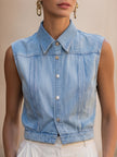 Light wash sleeveless denim vest for women with button-down front, stylish FJØRNA top, perfect for casual outfits.